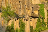 Stock photo of the medieval almshouses of Arlington Row, at Bibury, Gloucestershire Cotswolds. Part of the UK Travel and Heritage Image Library from Britain Express, Cotswold Collection