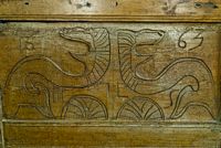 Carved serpents or dragons on the pulpit, dated 1663