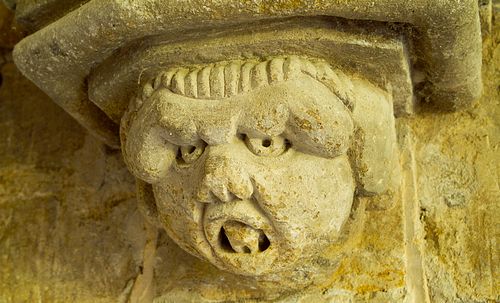 Carved head south porch