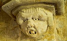 Carved head south porch