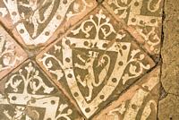 13th century floor tiles in the remains of the original refectory
