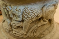 Carved lion figure on the font