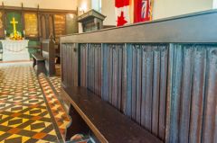 17th century linenfold panelling incorporated into a pew