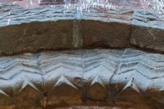 Outer arch chevron carvings
