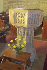 The finely carved 15th century font