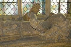 The south transept features the tomb of a 14th century knight and lady
