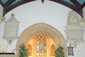The chancel arch and wall monuments