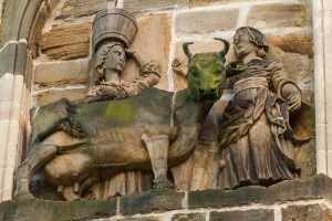 Carving depicting the 'Dun Cow' story