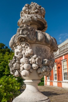A classical urn outside the house