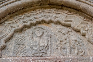 Bishop and tree carvings, tympanum