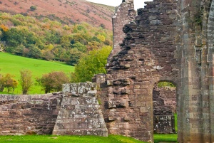 Ruined walls with the Welsh hills beyond