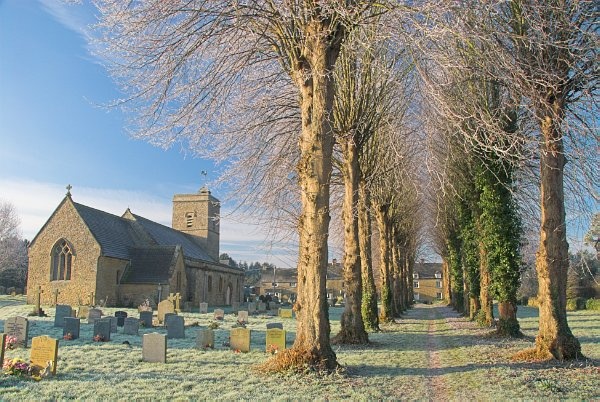 An avenue of trees leads past the parish church in Ascott under Wychwood