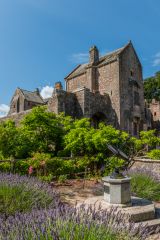 A garden sundial with the castle beyond