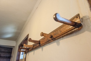 17th century hat pegs outside the schoolroom