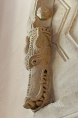 Chancel arch beast head carving