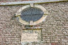 The bulls-eye window in the west facade