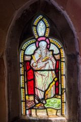 St Matthew stained glass window in the porch