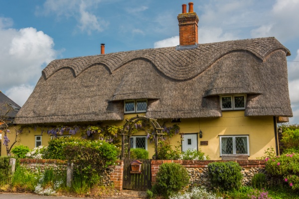 A thatched cottage on the green in Redgrave