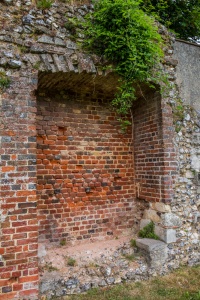 Brick-lined blocked opening in the wall