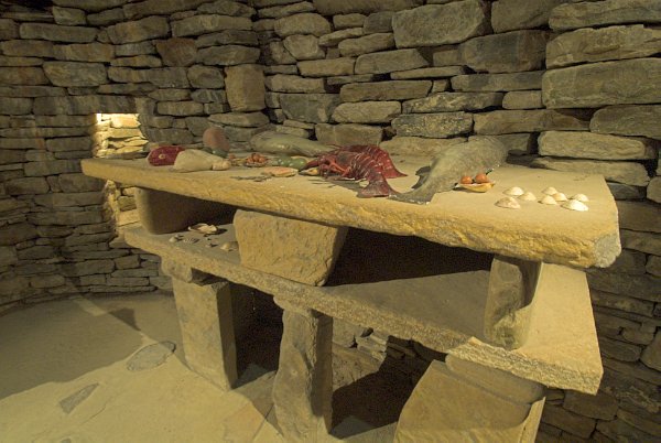 Not your typical flatpack shelving unit! The stone shelves in the reconstructed hut. Photo of Skara Brae, a prehistoric village on the Orkney Islands, Scotland.