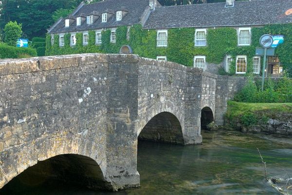 Photo Of The River Coln And Swan Hotel Bibury Gloucestershire Bridge Over The River Coln With Famous Bibury Landmark Of Swan Hotel In