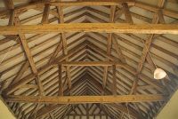 The nave roof, an excellent example of what is termed 'open-trussed rafter and queen post' construction