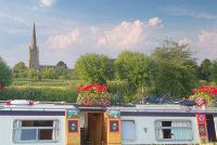 A colourful narrowboat moored at Lechlade