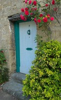 Another cottage doorway framed by June blossoms