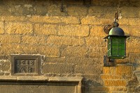 A lantern and date inscribed over a cottage door