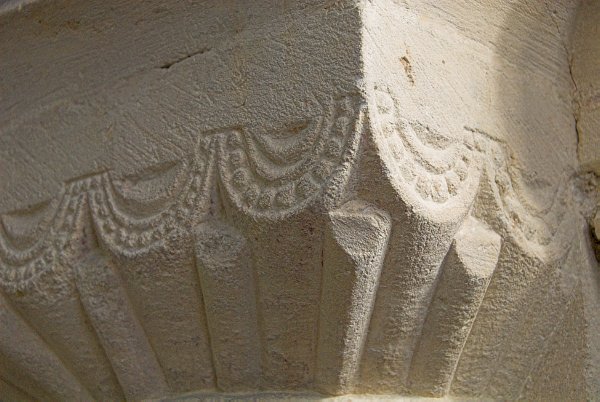 A close-up of beadwork decoration on the column capitals of the nave. Photo of St Andrew's Church, Chedworth, Gloucestershire.