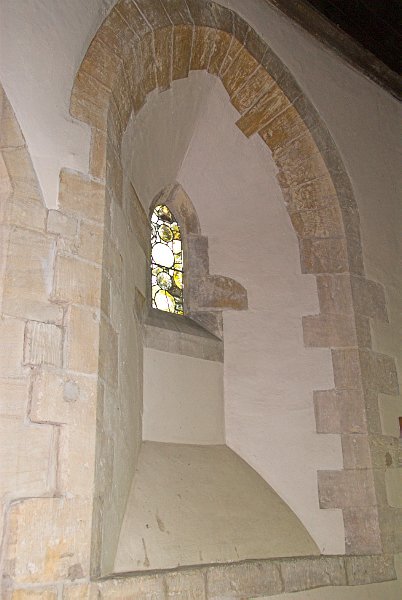 The oldest window in St Andrews is this 13th century one in the north wall of the chancel. Photo of St Andrew's Church, Chedworth, Gloucestershire.