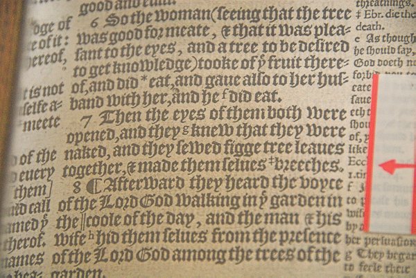 This copy of a 'Breeches Bible' is in the north aisle. The name refers to a passage in Genesis where the translation tells that Adam and Eve took fig leaves and made themselves breeches. Photo of St Andrew's Church, Chedworth, Gloucestershire