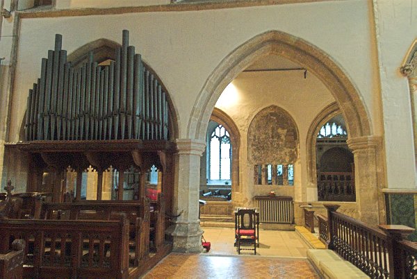 Looking through the choir to the north aisle and chapels beyond. Photo of the Church of St John Baptist, Cirencester, Gloucestershire.