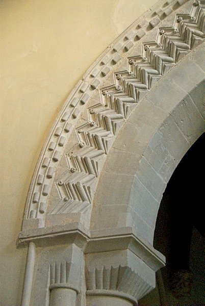 Photo of the decorative stone work on the Norman chancel arch. Photo of St Mary's Church, Great Barrington, Gloucestershire.