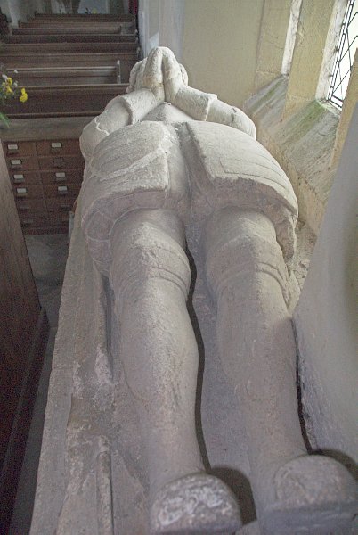 Effigy of Captain Edmond Bray, against the north wall of the aisle. Photo of St Mary's Church, Great Barrington, Gloucestershire.
