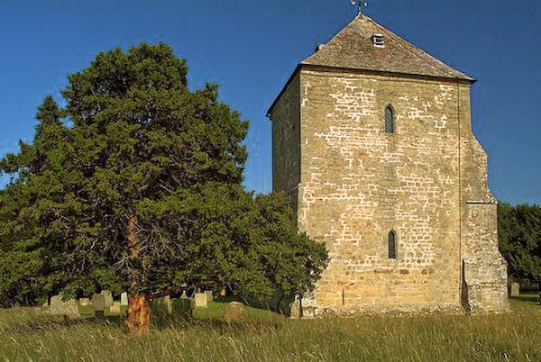The 12th century tower and west end. Photo of St Mary's Church, Kempley, Gloucestershire.