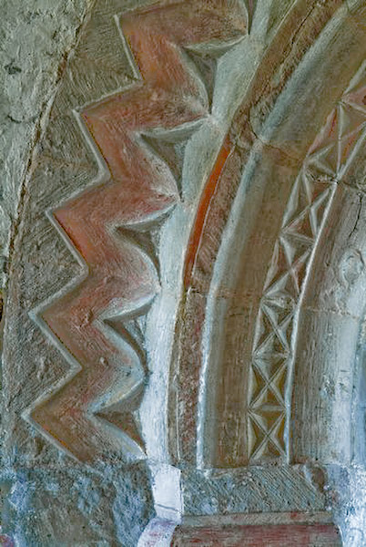 The chancel arch. The decorative detail is quite extraordinary throughout the church. Photo of St Mary's Church, Kempley, Gloucestershire.