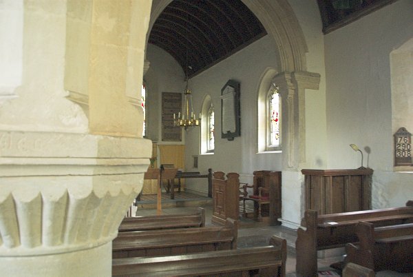 Looking from the north aisle into the nave. Photo of St Peter's Church, Little Barrington, in the Gloucestershire Cotswolds. Part of the Britain Express travel and heritage picture library.