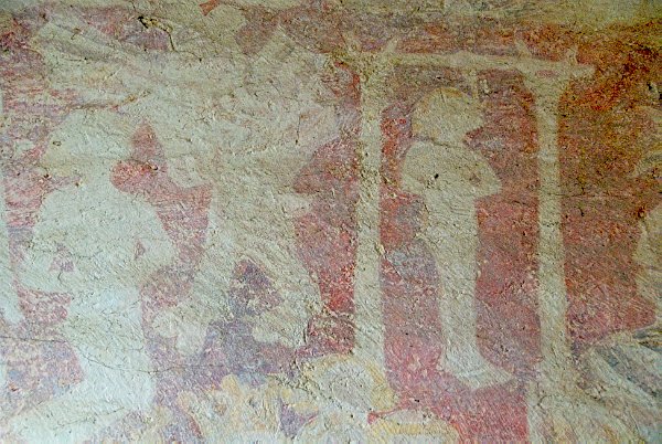 The right side (east) of the Doom painting depicts sinners being dragged into hell where Satan awaits them. Some are being boiled in a large pot, one man is being hung while a kneeling figure awaits his turn. Photo of St Nicholas' Church, Lower Oddington, Gloucestershire. Part of the Britain Express historic picture library.