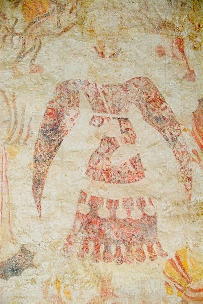 The central figure of the 'Magnificence' mural is this tall, elegantly dressed man, who possibly represents Cardinal Wolsey. Photo of St Nicholas' Church, Lower Oddington, Gloucestershire. Part of the Britain Express historic picture library.
