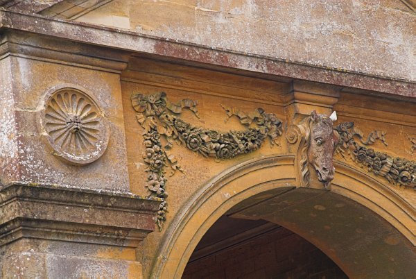 Rendcomb College - architectural detail on the stable block. The parish church of St Peter is  beside the school entrance. Photo of Rendcomb, in the Gloucestershire Cotswolds. Part of the Britain Express Travel and Heritage Picture Library.