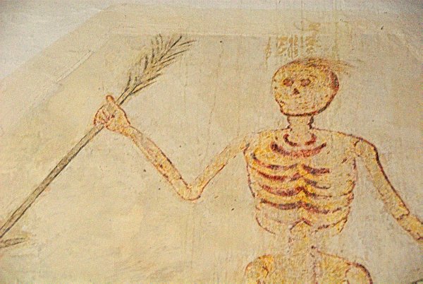 A closer view of the skeletal wall painting. It is thought that the skeleton may be an early representation of Father Time. Photo of All Saints Church, Salperton, Gloucestershire. Part of the Britain Express Historic Picture Library.