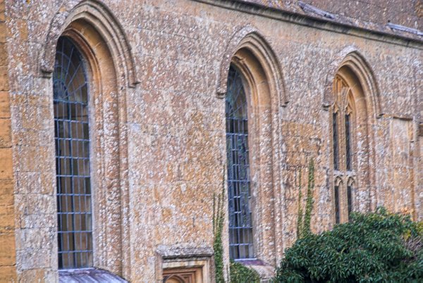 View of the nave windows. The third window in the row still has medieval tracery. Photo of St Mary's Church, Temple Guiting, Gloucestershire. Part of the Britain Express Historic Picture Library.