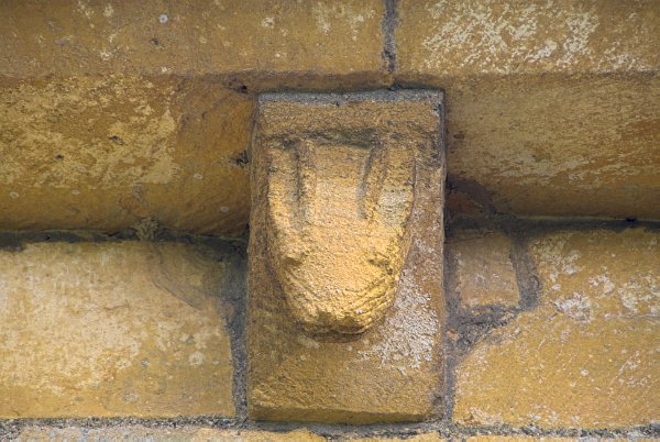 Many of the Temple Guiting corbel table figures are quite similar to the more famous figures at Kilpeck in Herefordshire. Photo of St Mary's Church, Temple Guiting, Gloucestershire. Part of the Britain Express Historic Picture Library.
