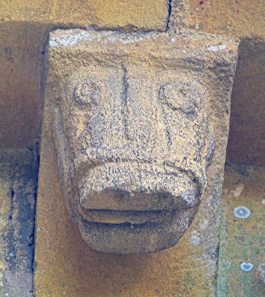 Moving along the corbel table we see another head of a beast. Perhaps this one is a horse with a halter. Photo of St Mary's Church, Temple Guiting, Gloucestershire. Part of the Britain Express Historic Picture Library.