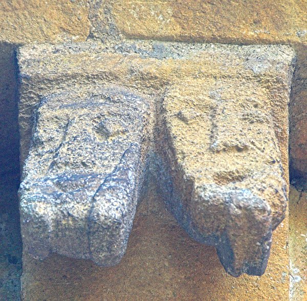 Only one corbel features two heads, all the rest show a single carving. Photo of St Mary's Church, Temple Guiting, Gloucestershire. Part of the Britain Express Historic Picture Library.