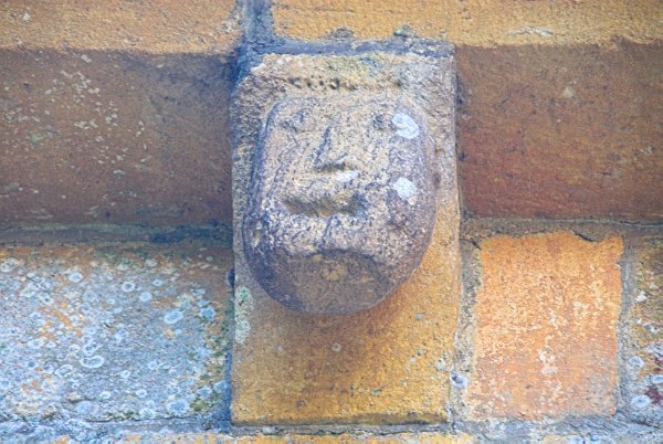 Another human figure, now on the south side of the chancel wall. Photo of St Mary's Church, Temple Guiting, Gloucestershire. Part of the Britain Express Historic Picture Library.
