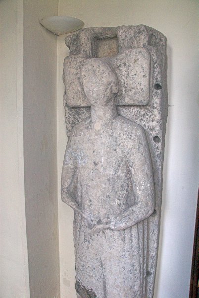 This effigy of a medieval wool merchant stands upright in the north ambulatory. Photo of St Mary the Virgin, Tetbury, Gloucestershire. Part of the Britain Express Historic Picture Library.