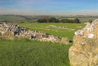 The castle walls with the cathedral foundations beyond