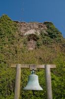 Church bell and ruined tower